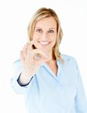 Confident young businesswoman showing OK sign