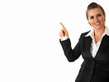 smiling modern business woman pointing finger