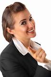 smiling modern business woman pointing finger at you
