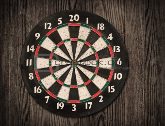  Dartboard on old wooden wall.