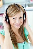 Bright caucasian woman listening to music with headphones in the