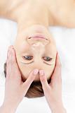 Attractive caucasian woman having a head massage 