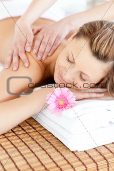Relaxed young woman having a back massage