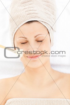Charming relaxed woman receiving beauty treatment 