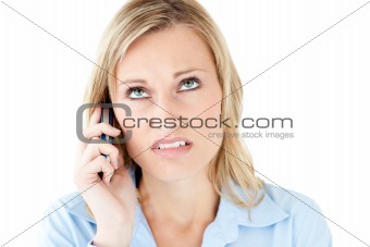 Frustrated businesswoman talking on phone 