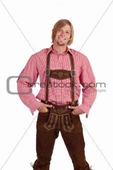 Happy casual Bavarian man with oktoberfest leather trousers (lederhose)