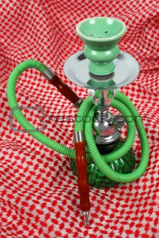 Water pipe on traditional Arabic cloth