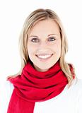 Portrait of a beautful woman with a red scarf smiling at the cam