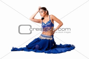 Belly dancer sitting in blue dress