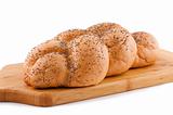 Bread roll with poppy white background.