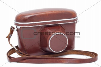 Old camera in a cover isolated on a white background shadow belo