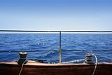 sailboat winches wooden board blue sea horizon