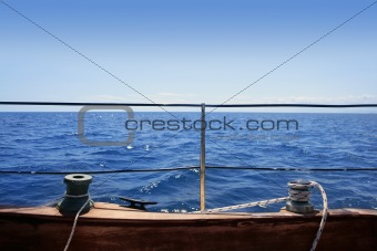 sailboat winches wooden board blue sea horizon