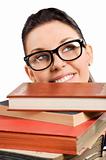student with glasses behind books