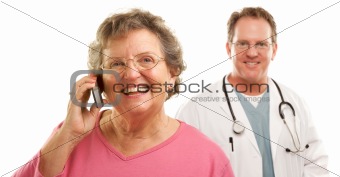 Happy Senior Woman Using Cell Phone with Male Doctor or Nurse Behind Isolated on a White Background.