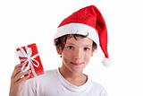 Cute christmas boy with a red gift isolated on white background, studio shot.