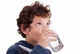 cute boy drinking  water, isolated on white, studio shot