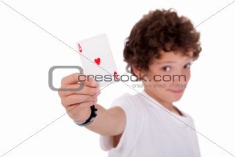 cute boy showing an ace of hearts, isolated on white, studio shot