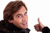 Portrait from back of a young man with thumb up, in autumn/winter clothes, isolated on white. Studio shot
