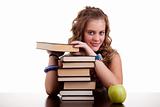 happy beautiful girl , with a stack of books, and a apple, isolated on white. Studio shot