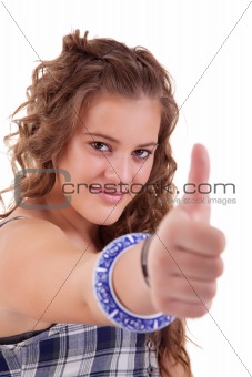 pretty girl with thumb raised as a sign of success, isolated on white background. Studio shot.