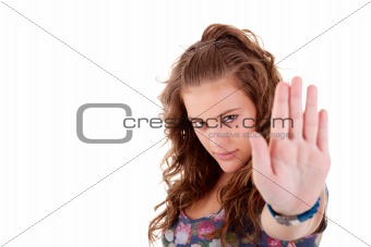 young girl  with his hand raised in signal to stop, isolated on white background, Studio shot