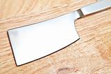 Steel cleaver on cutting table