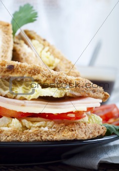 fresh and delicious classic club sandwich with coffee