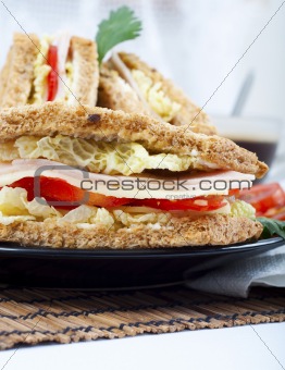 fresh and delicious classic club sandwich with coffee