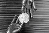 silver euro coins in futuristic robot hands