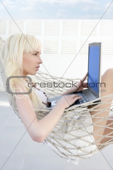 blonde young student fashion girl laptop hammock 