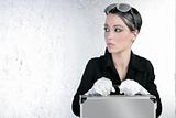 futuristic businesswoman holding silver briefcase