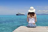 Tourist back woman looking Formentera turquoise sea