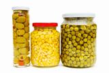 Various pickles in the glass jars on white