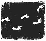 Footprints silhouette on grunge background