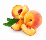 fresh peach fruits with green leaves