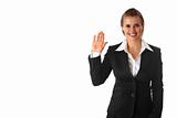 friendly modern business woman showing salutation gesture
