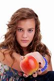 Beautiful girl with a red apple, isolated on white background. Studio shot.