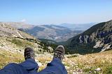 Person Relax on Top of a Mountain Against Great Panorama