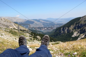 Person Relax on Top of a Mountain Against Great Panorama