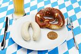 bavarian veal sausage setup with beer from top