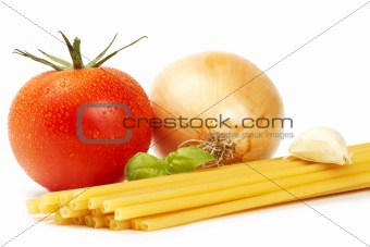 raw macaroni with basil, tomato, onion and garlic clove 
