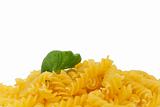 some raw fusilli with wet basil