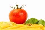some raw penne rigate with tomato and basil