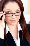 Charismatic caucasian businesswoman holding her glasses