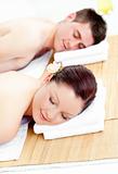 Resting caucasian couple lying on a massage table