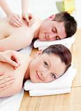 Delighted caucasian couple receiving a back massage