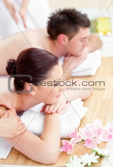 Attractive young couple enjoying a back massage