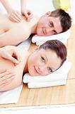 Relaxed caucasian couple receiving a back massage