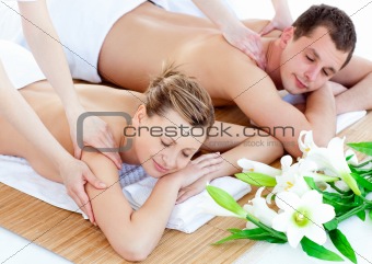 Charming young couple enjoying a back massage